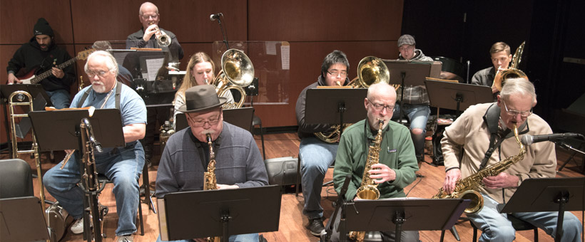 Music students performing on stage in Maier Hall