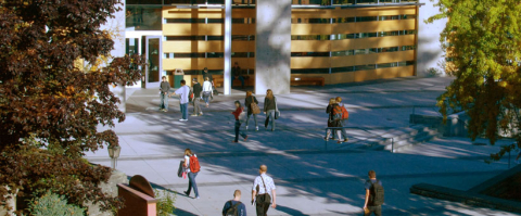 Students walking on campus courtyard